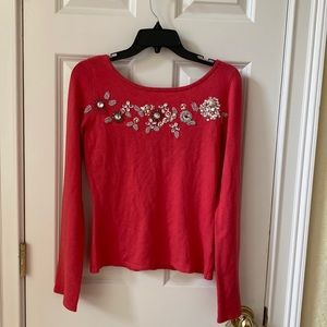 Moda International long sleeve top with sequins, boat neck,bow at the back.
